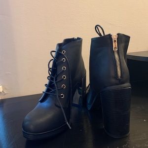 Platform bootie. Gold detailing.